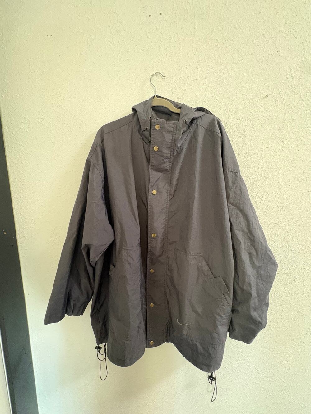 Vintage Nike hooded jacket in charcoal gray, tagged XL